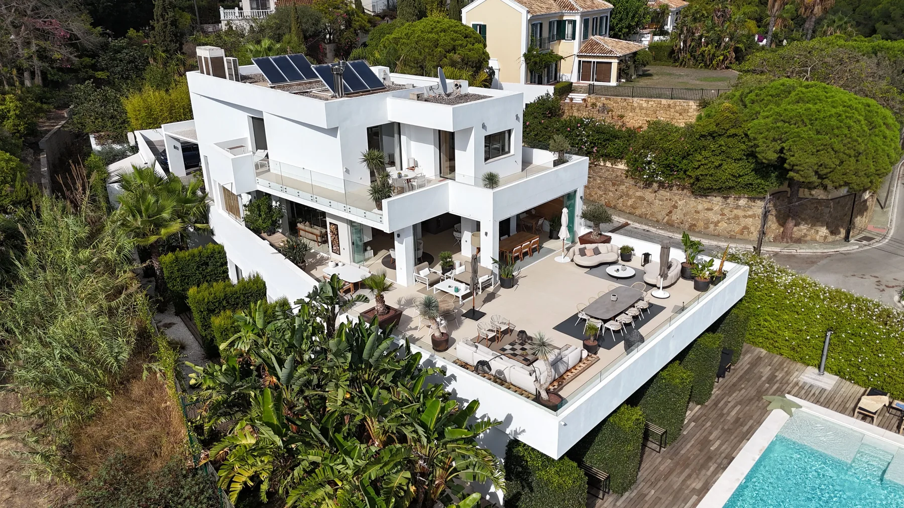 Modern white villa in Marbella with spacious terraces, gardens and a swimming pool